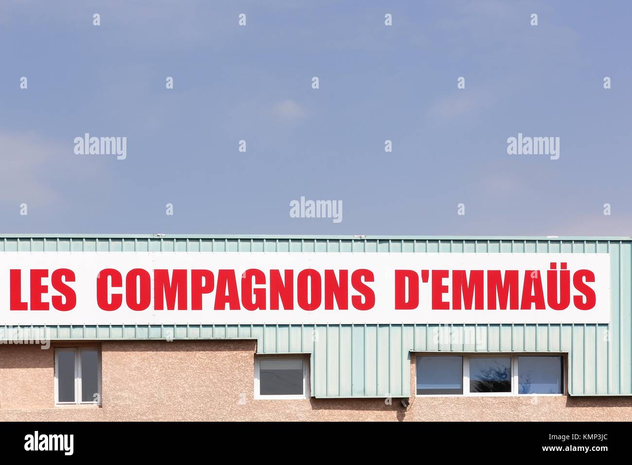 Sassenage, France - June 24, 2017: Companions Emmaus sign on a wall. Emmaus is an international solidarity movement founded in 1949 by Abbe Pierre Stock Photo