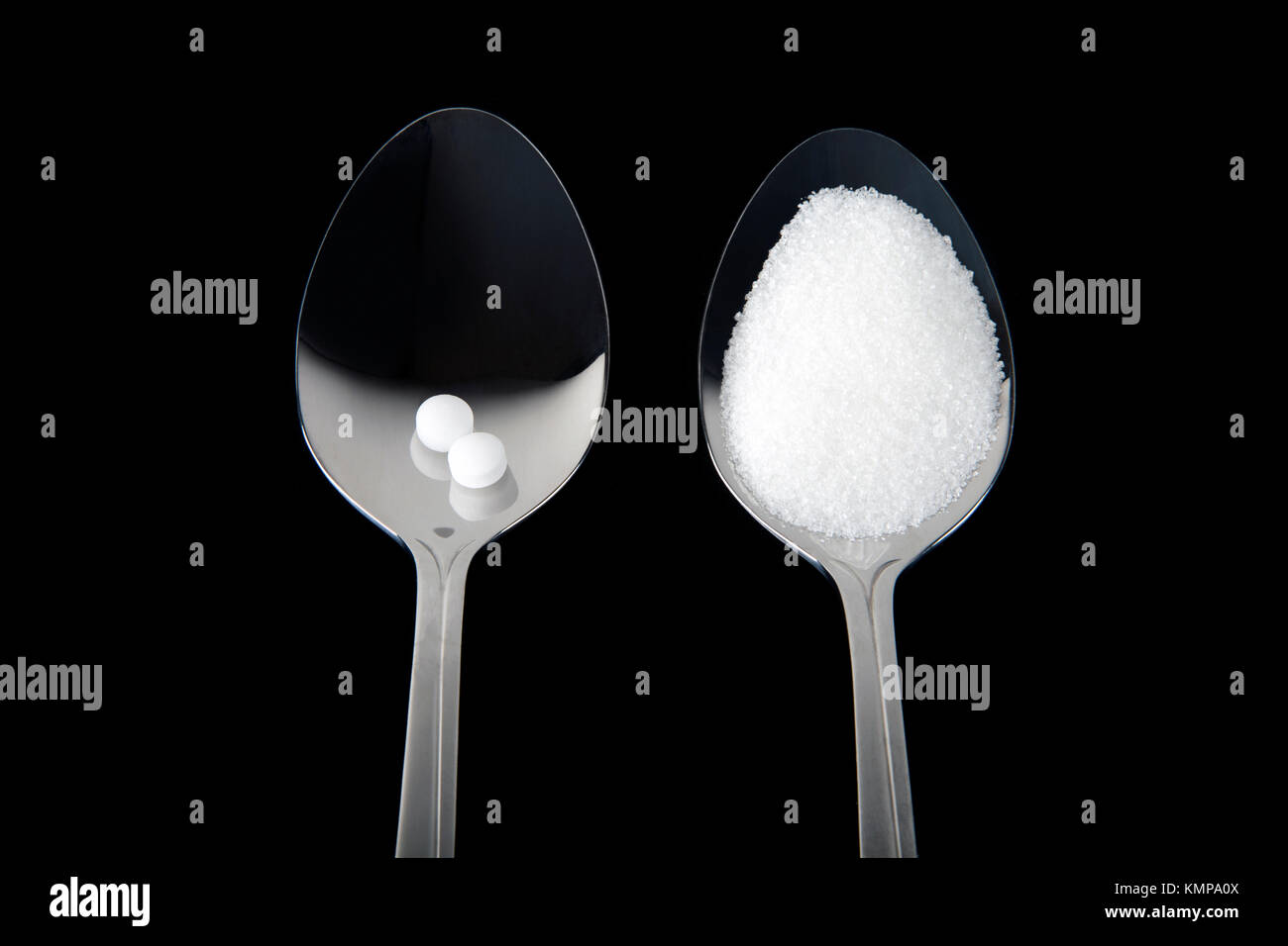 Studio shot of spoons with sweetener and white sugar Stock Photo