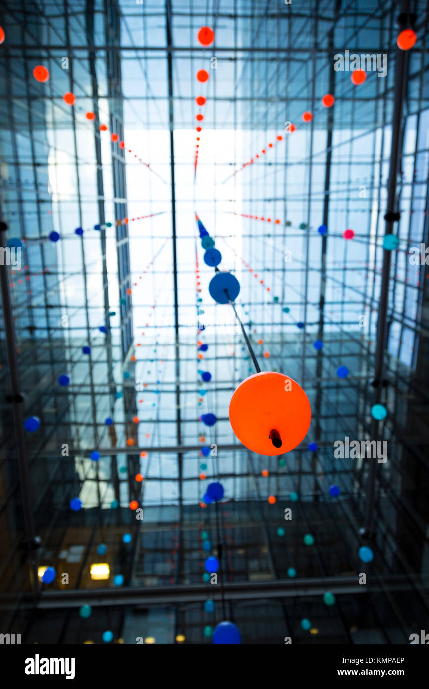 Luminescent spheres suspended in an atrium inside an office building,  'Pixel Cloud' installation by Daniel Hirchmann (One Bishops Square, London. UK) Stock Photo