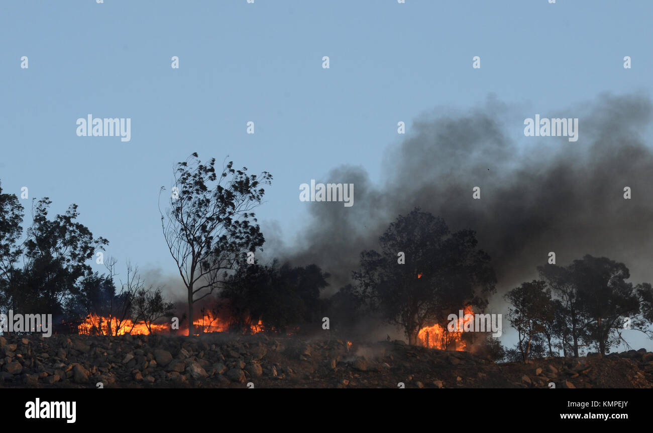 December 7, 2017 - A home is engulfed in flames after a wind driven brush fire consumed hundreds of acres of land in Murrieta, CA on December 7, 2017. (Credit Image: © Steven K. Doi via ZUMA Wire) Stock Photo