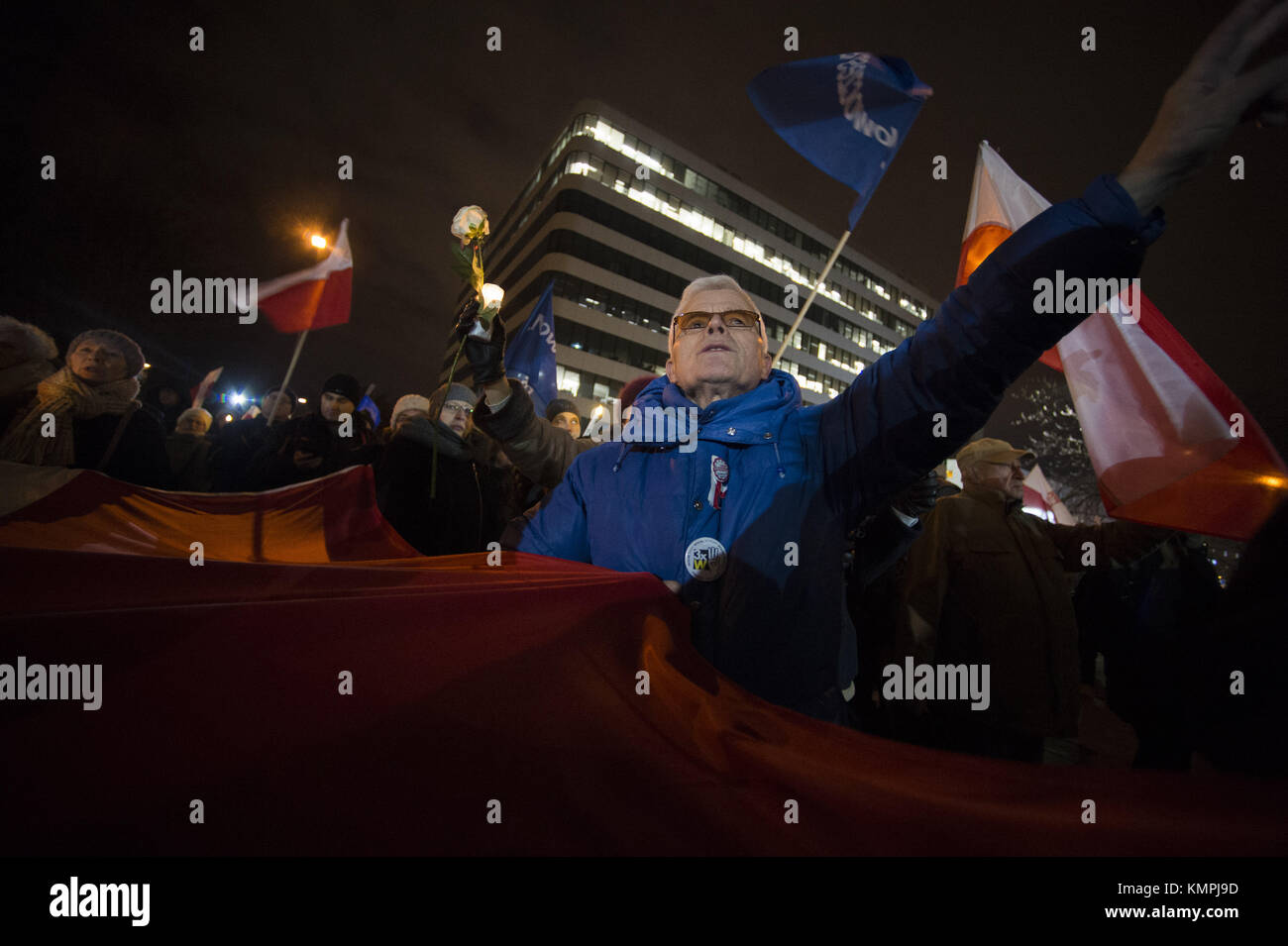 Krakow, Poland. 8th Dec, 2017. People gather in front of Krakow Court while holding a large banner to protest against the new judicial reforms. Today, The Polish parliament approved the government proposals to hand the ruling Law and Justice party (PiS) total control of judicial appointments and the supreme court. Credit: Omar Marques/SOPA/ZUMA Wire/Alamy Live News Stock Photo