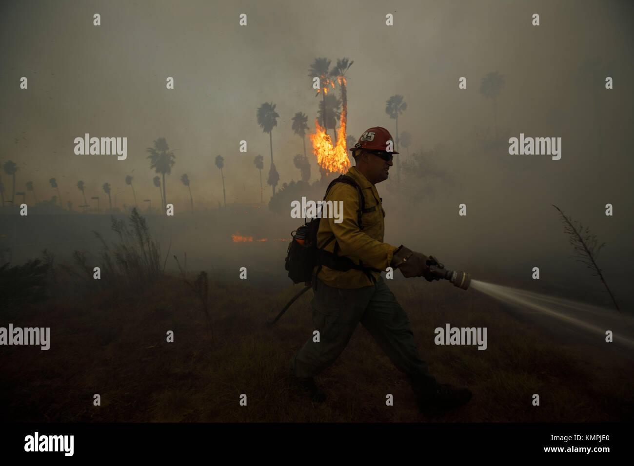 Bonsall, CA, USA. 7th Dec, 2017. Firefighters battle the wind-fanned ...
