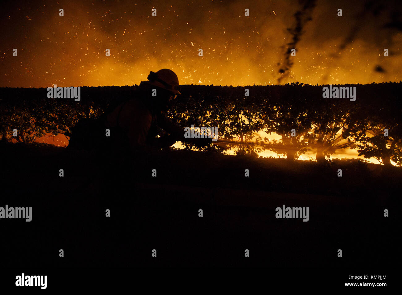 Bonsall, CA, USA. 7th Dec, 2017. A Camp Pendleton firefighter sprays ...
