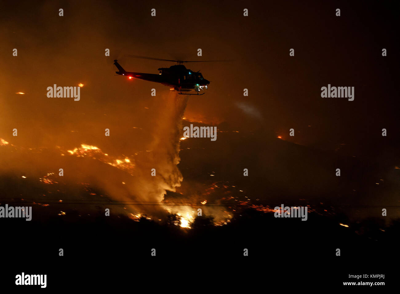 Bonsall, California, USA. 8th Dec, 2017. A firefighting helicopter