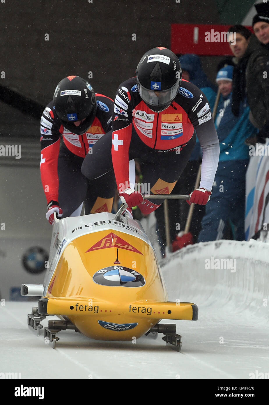 Swiss bobsleigh athletes Clemens Bracher and Michael Kuonen (back) in action during the men's two person bob event at the BMW IBSF World Cup in Winterberg, Germany, 9 December 2017. Photo: Caroline Seidel/dpa Stock Photo