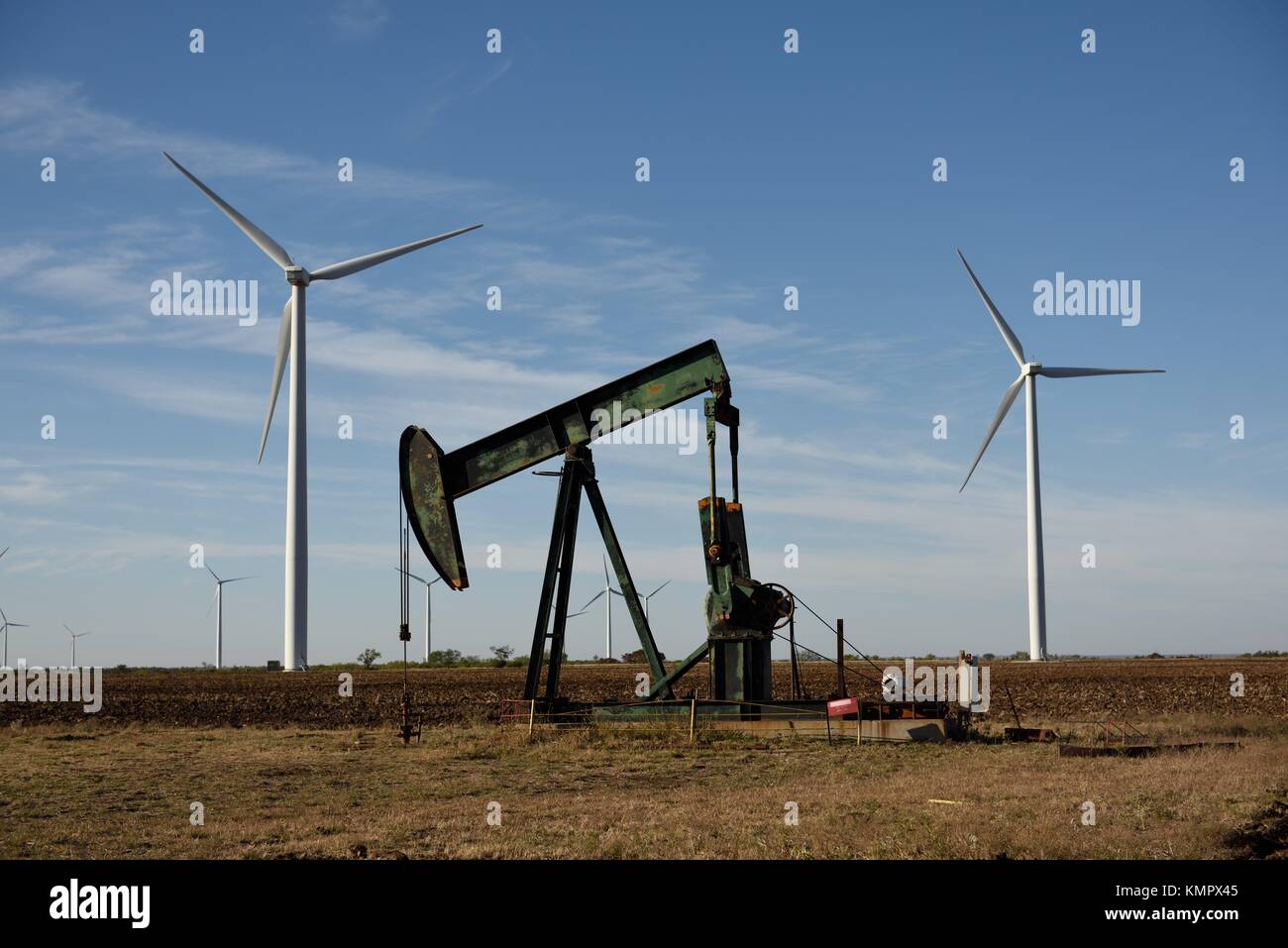 Framed crude oil pump jack, wind turbines, green environmental
