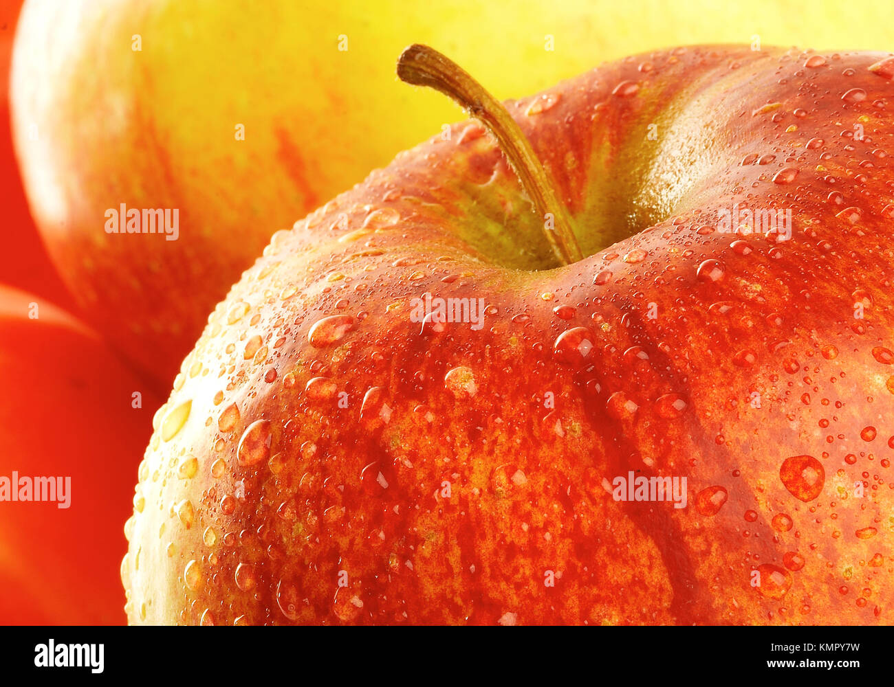 Fresh apple with drops of water. Stock Photo