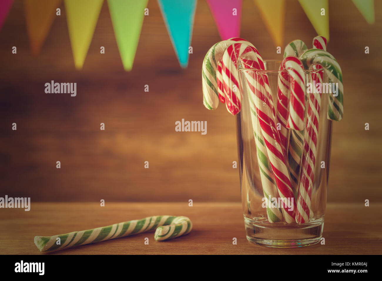 Candy cane in the glass. Christmas sweetness. Closeup. Solid festive ...