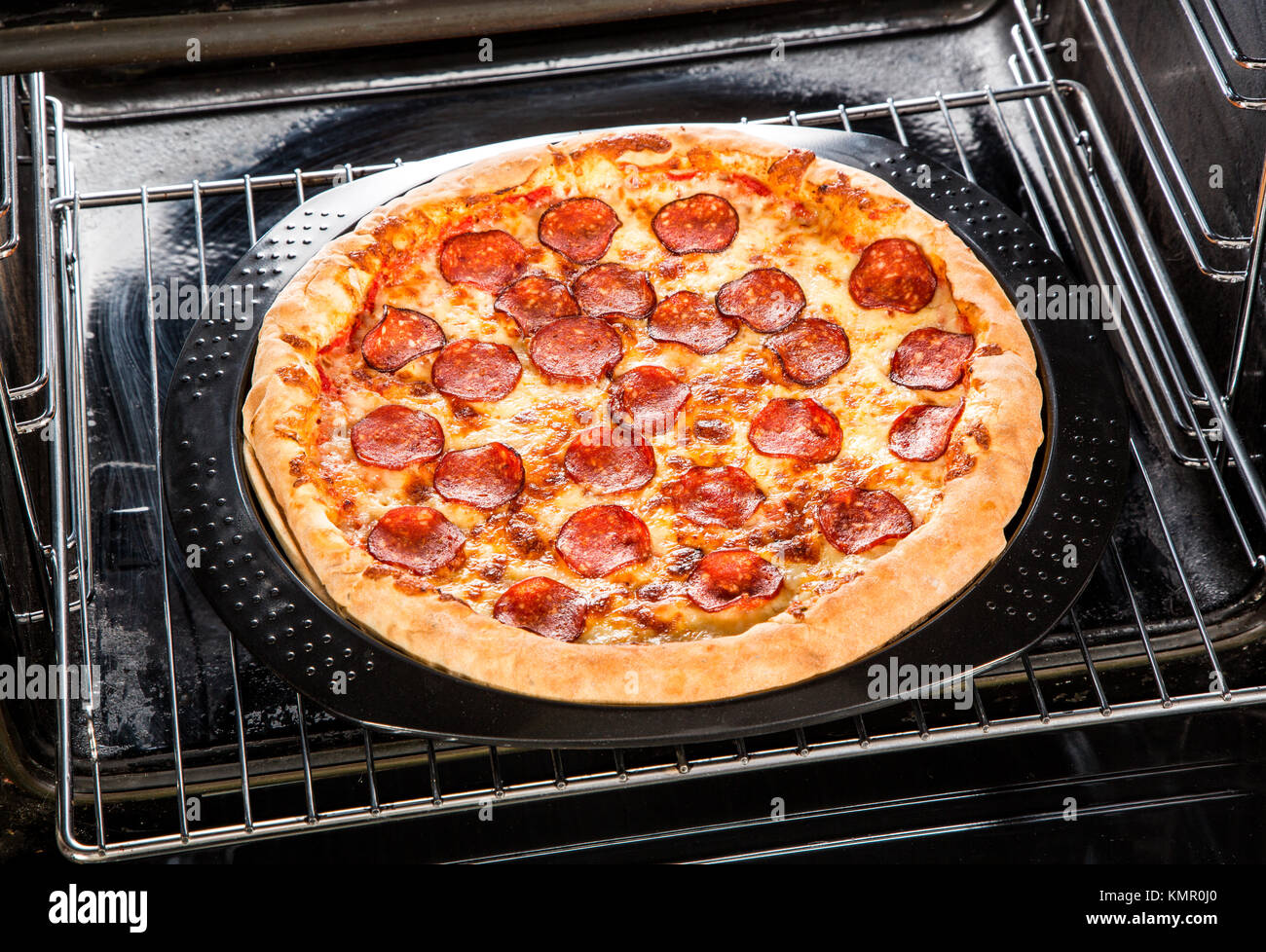 Pepperoni pizza in the oven, Cooking in the oven Stock Photo Alamy