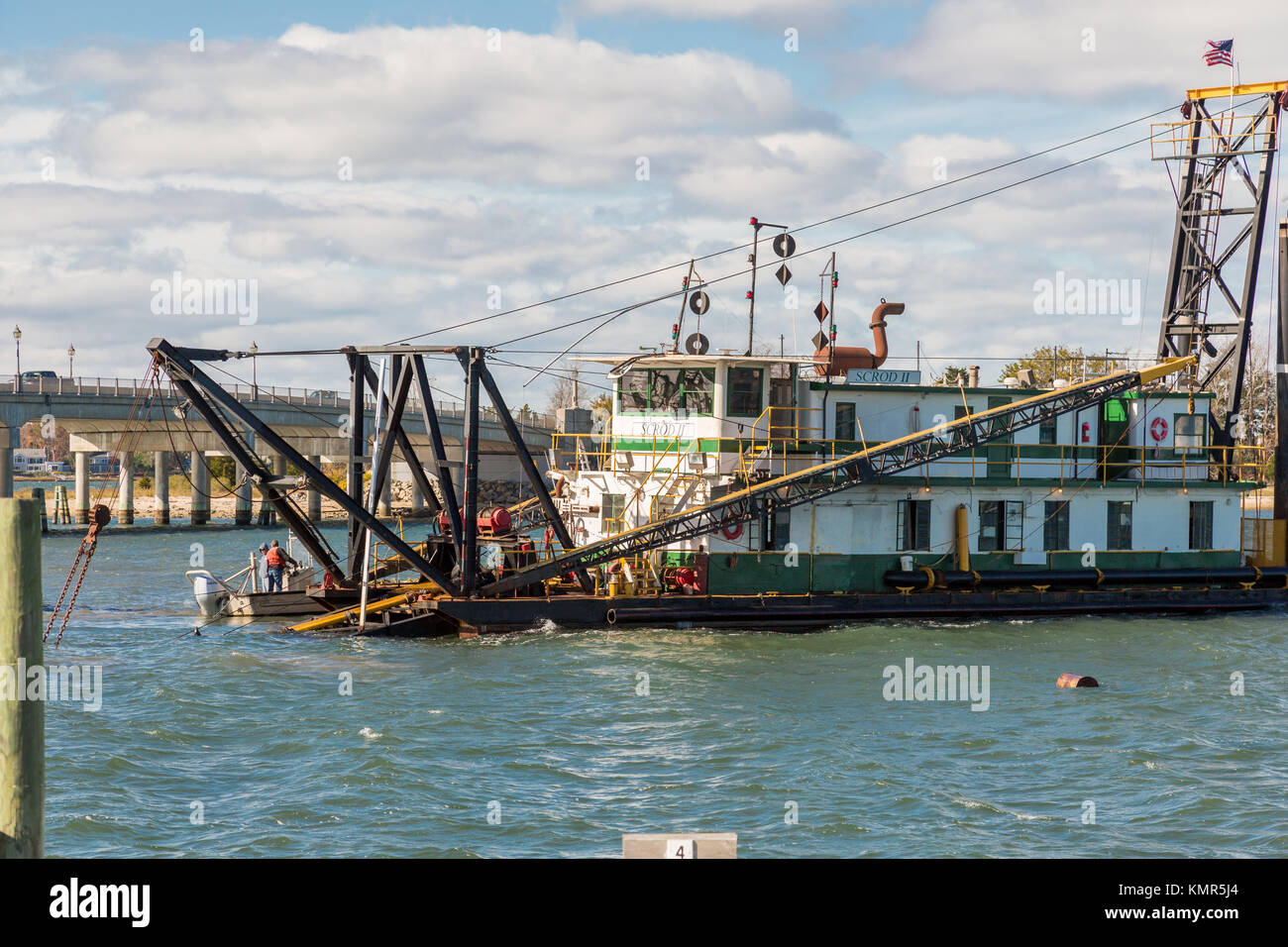 People working on boats off sag harbor's long wharf in sag harbor, ny, usa Stock Photo