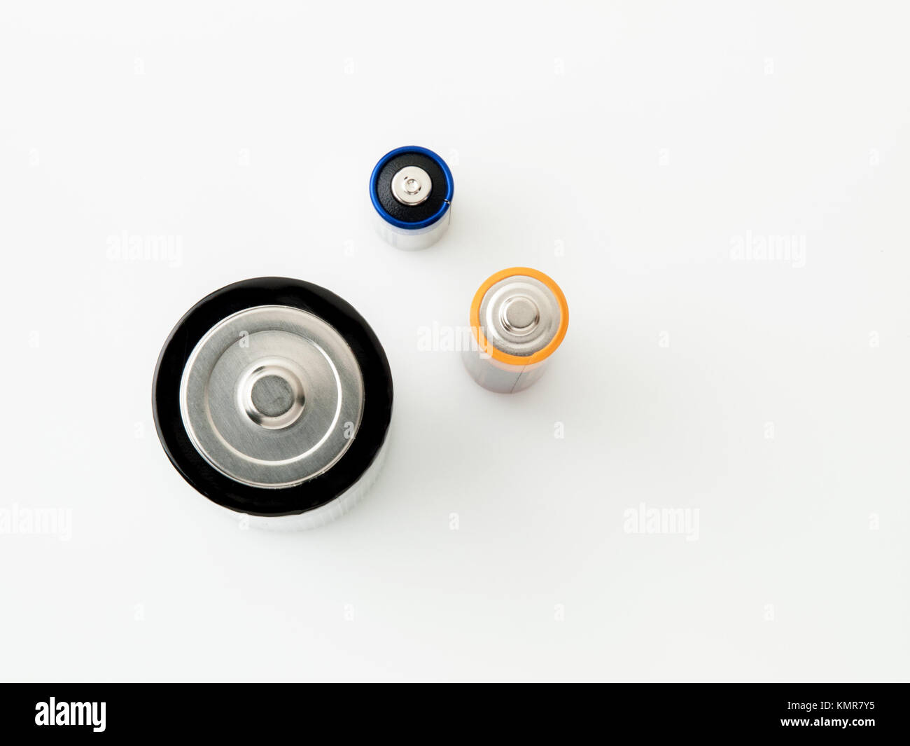 Close up detail of a group of three batteries (AA, D and 4LR44), isolated on white background Stock Photo