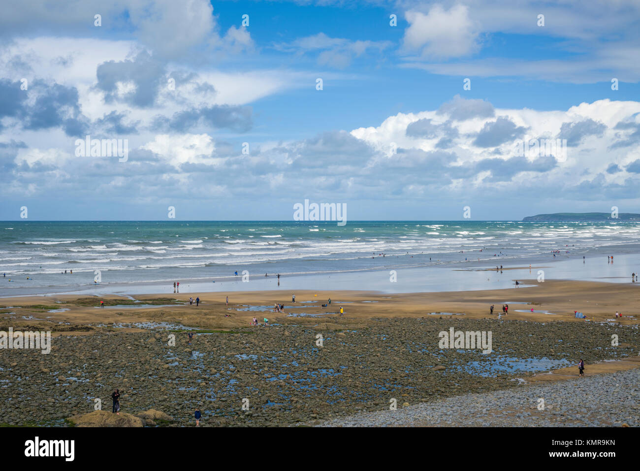People enjoying a summers day on the beach at Westward Ho! on the North Devon coast, England. Stock Photo