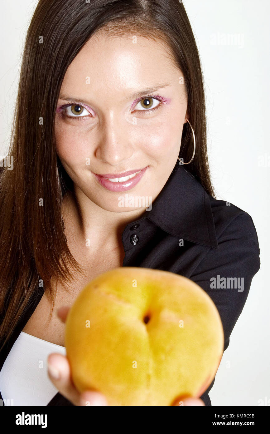 Woman with peach Stock Photo Alamy