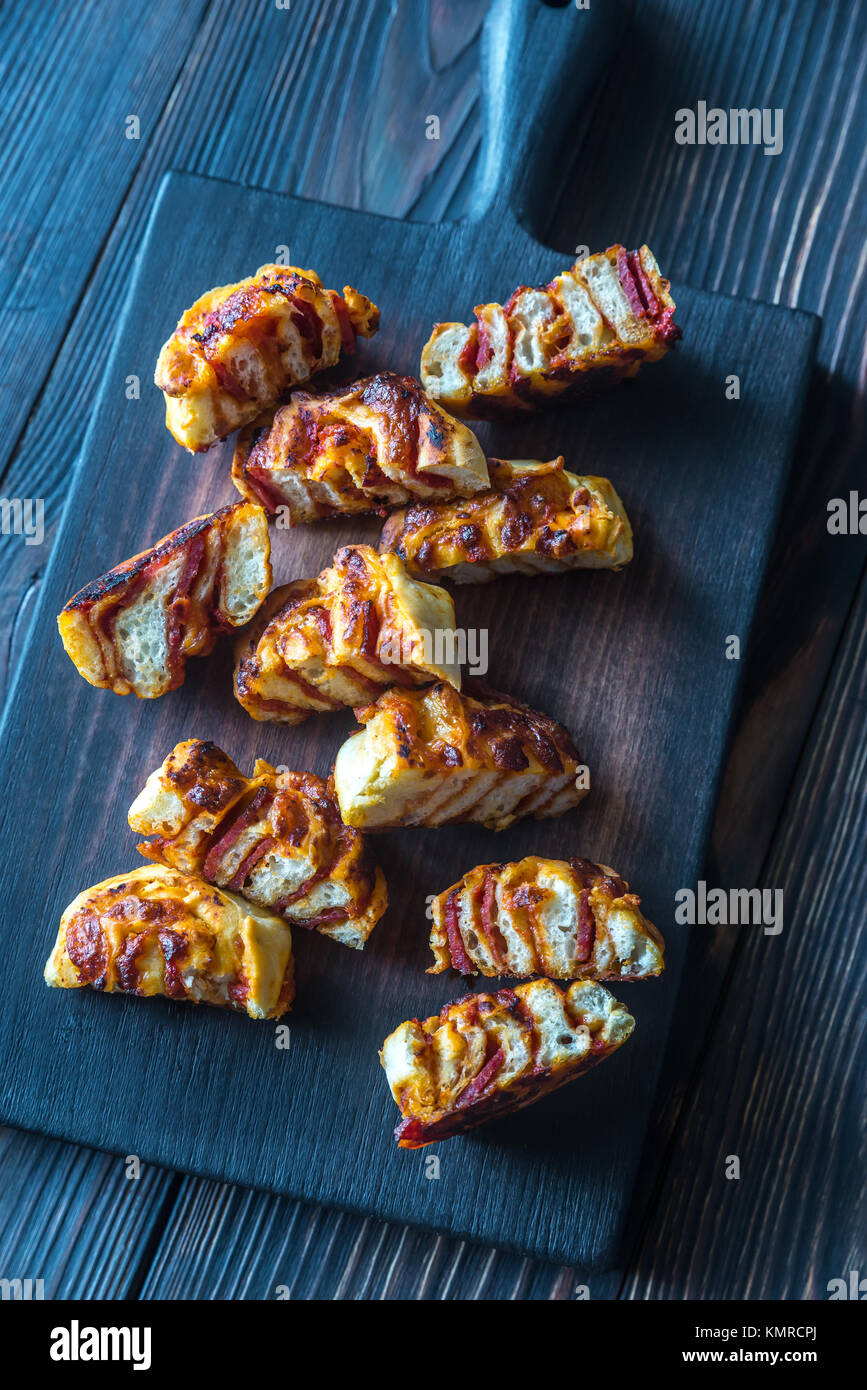 Pizza rolls on the wooden board Stock Photo