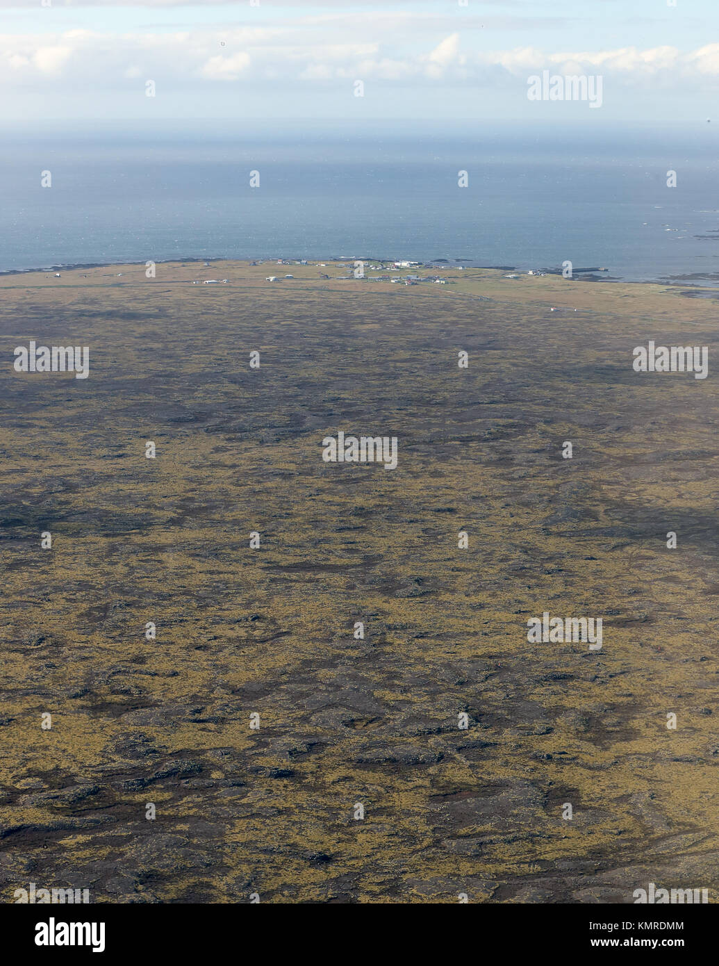 Flying in to Keflavik over the flat lava flow landscape of southwestern Iceland. Stock Photo