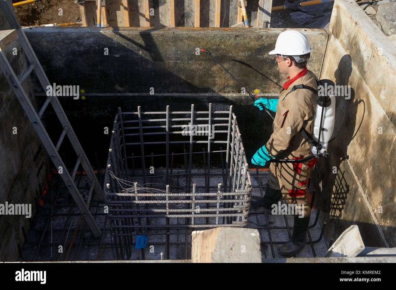 Applying form release agents with sprayer, concrete formworks Stock