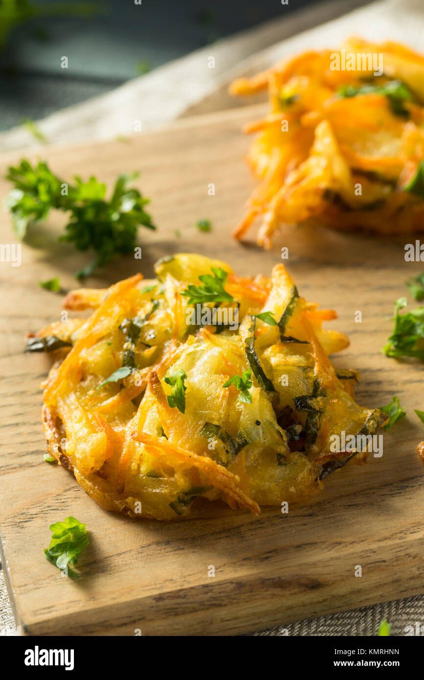Homemade Fried Vegetable Birds Nests with Onion and Parsley Stock Photo
