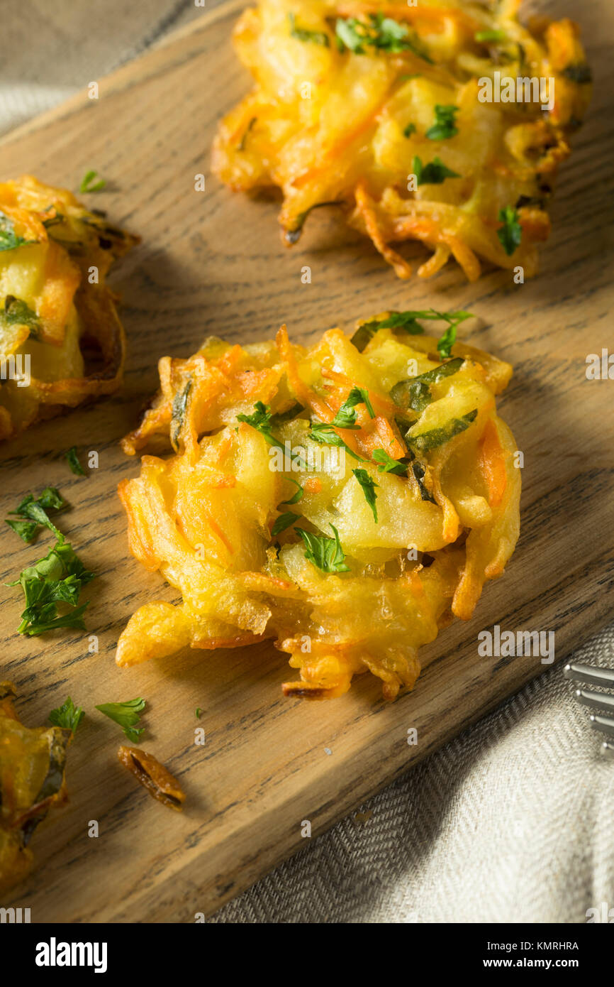 Homemade Fried Vegetable Birds Nests with Onion and Parsley Stock Photo