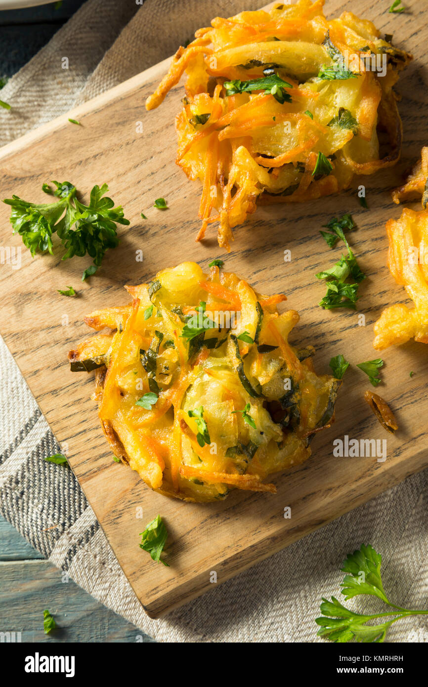 Homemade Fried Vegetable Birds Nests with Onion and Parsley Stock Photo