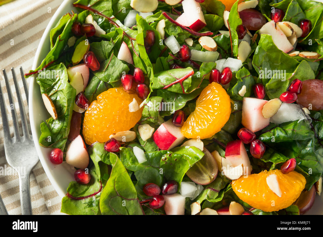 Raw Organic Winter Chard Salad with Oranges Almonds and Apples Stock Photo