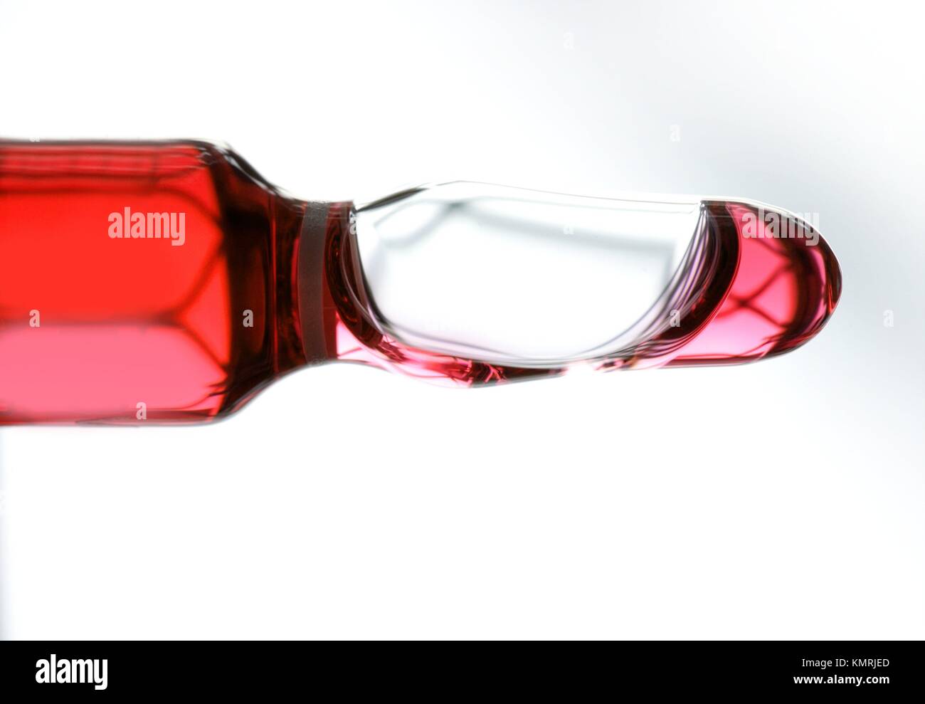 Glass ampoule with red liquid medicine inside Stock Photo Alamy