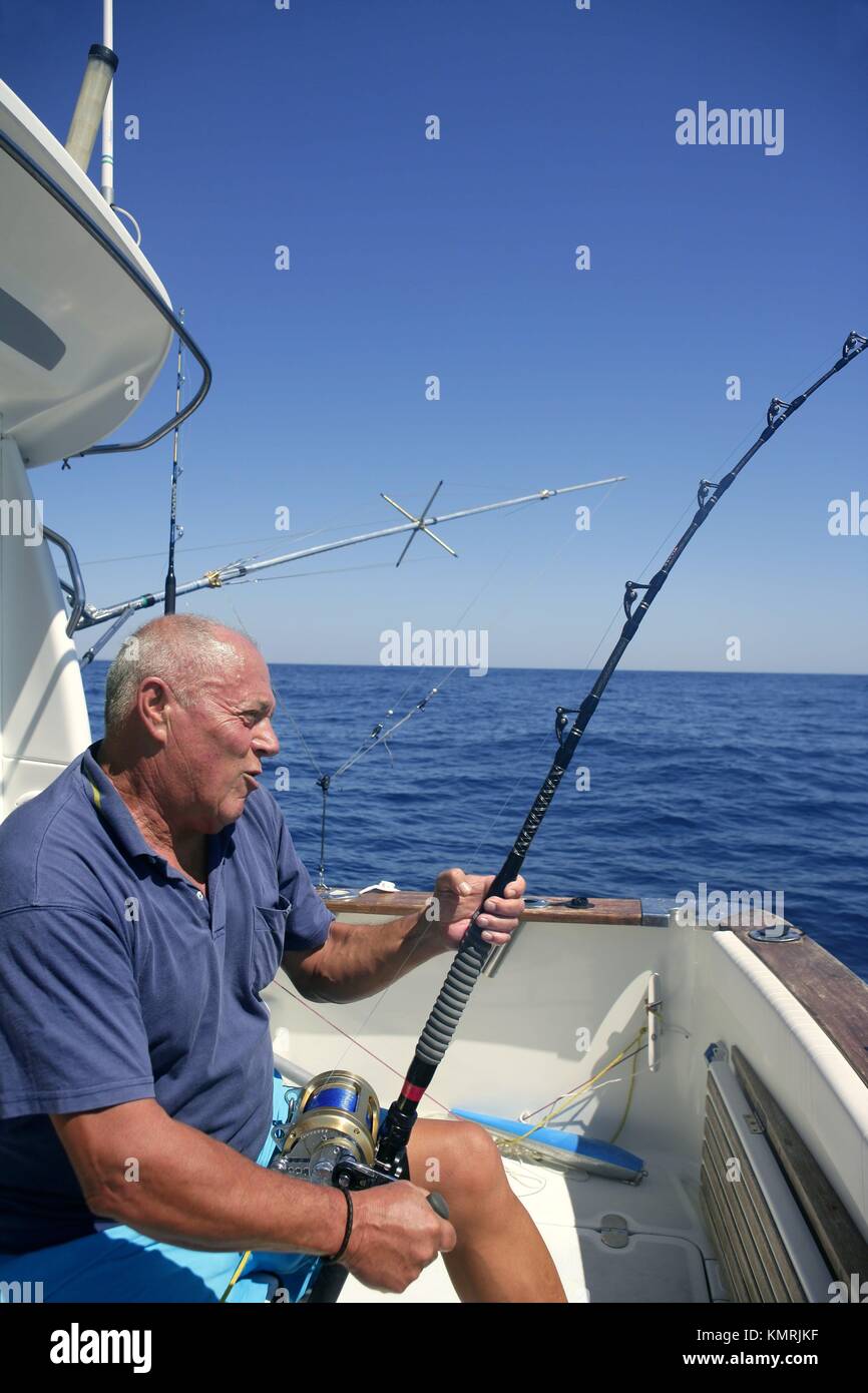 Angler elderly big game sport fishing boat blue summer sea sky Stock ...