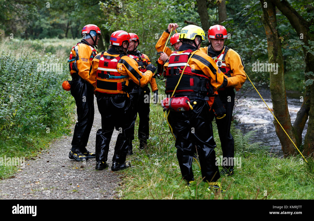 Upper Wharfedale Fell Rescue Association Swift Water Team taking part in a training exercise on the River Washburn Nidderdale Stock Photo