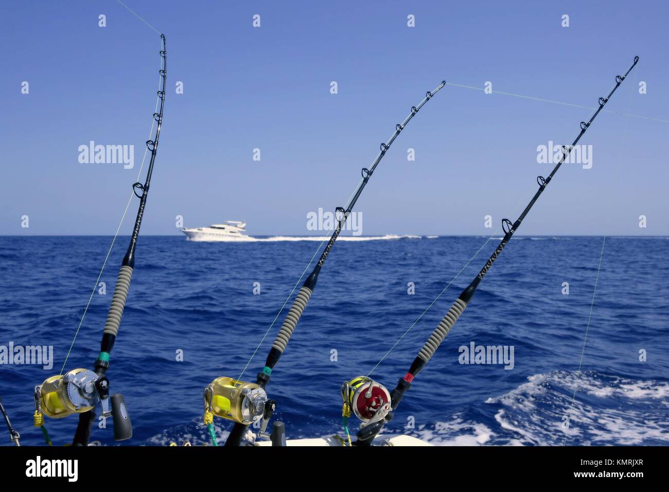 Blue sea and sky in a big game tuna fishing day rods and reels on boat Stock Photo Alamy