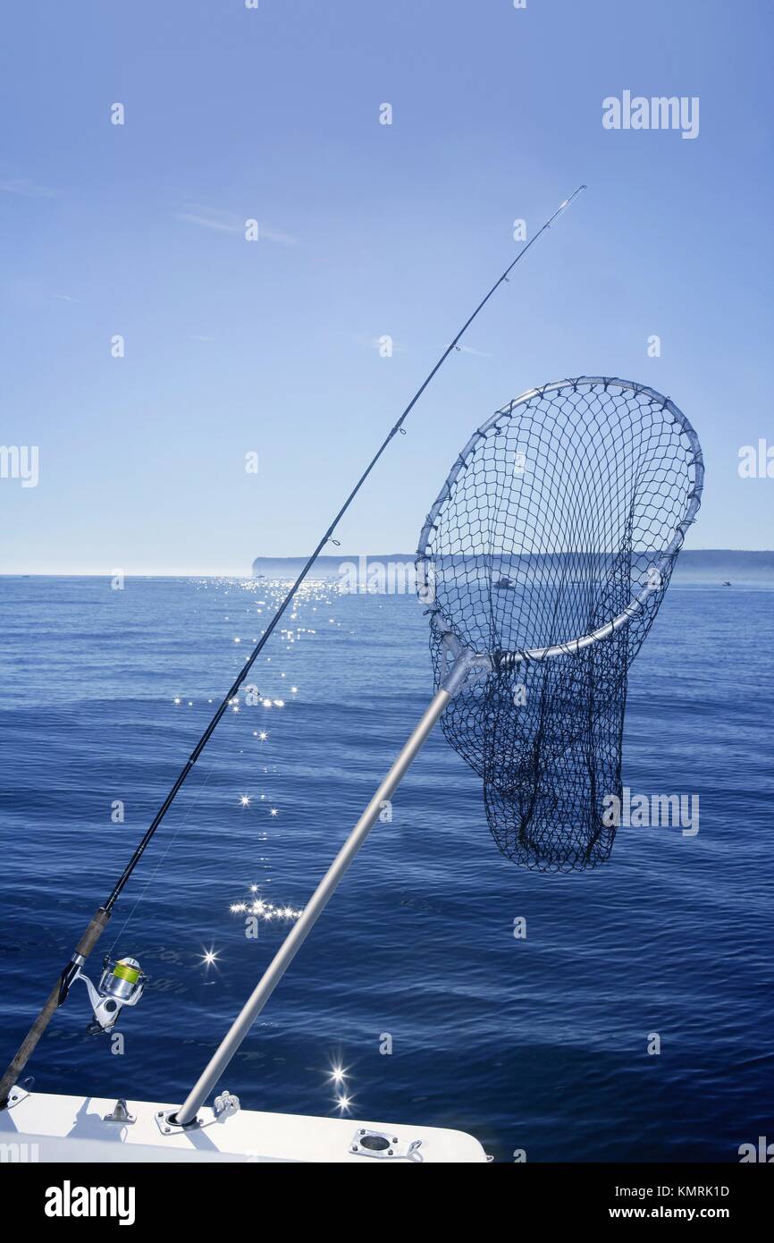 Fishing scoop net on boat with blue sea ocean background Stock