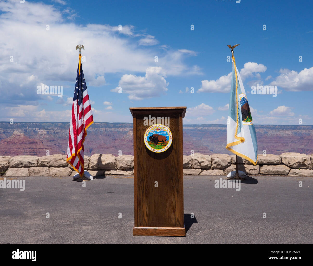 An empty speaker's podium with the seal of the US Department of the Interior and the American flag at the South Rim of the Gand Canyon Stock Photo