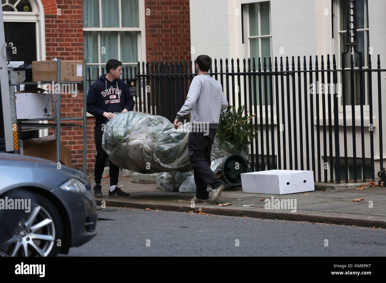 Workers remove Christmas trees and decorations from 11 Downing Street in London. Stock Photo