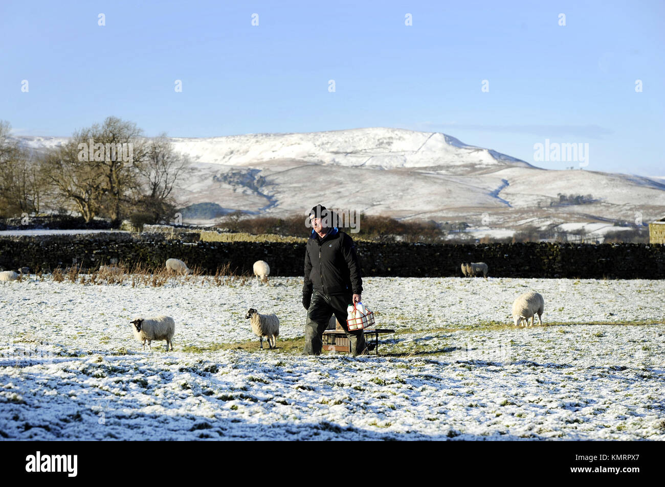 James Atkinson a milkman for Dales Dairies makes his deliveries in the