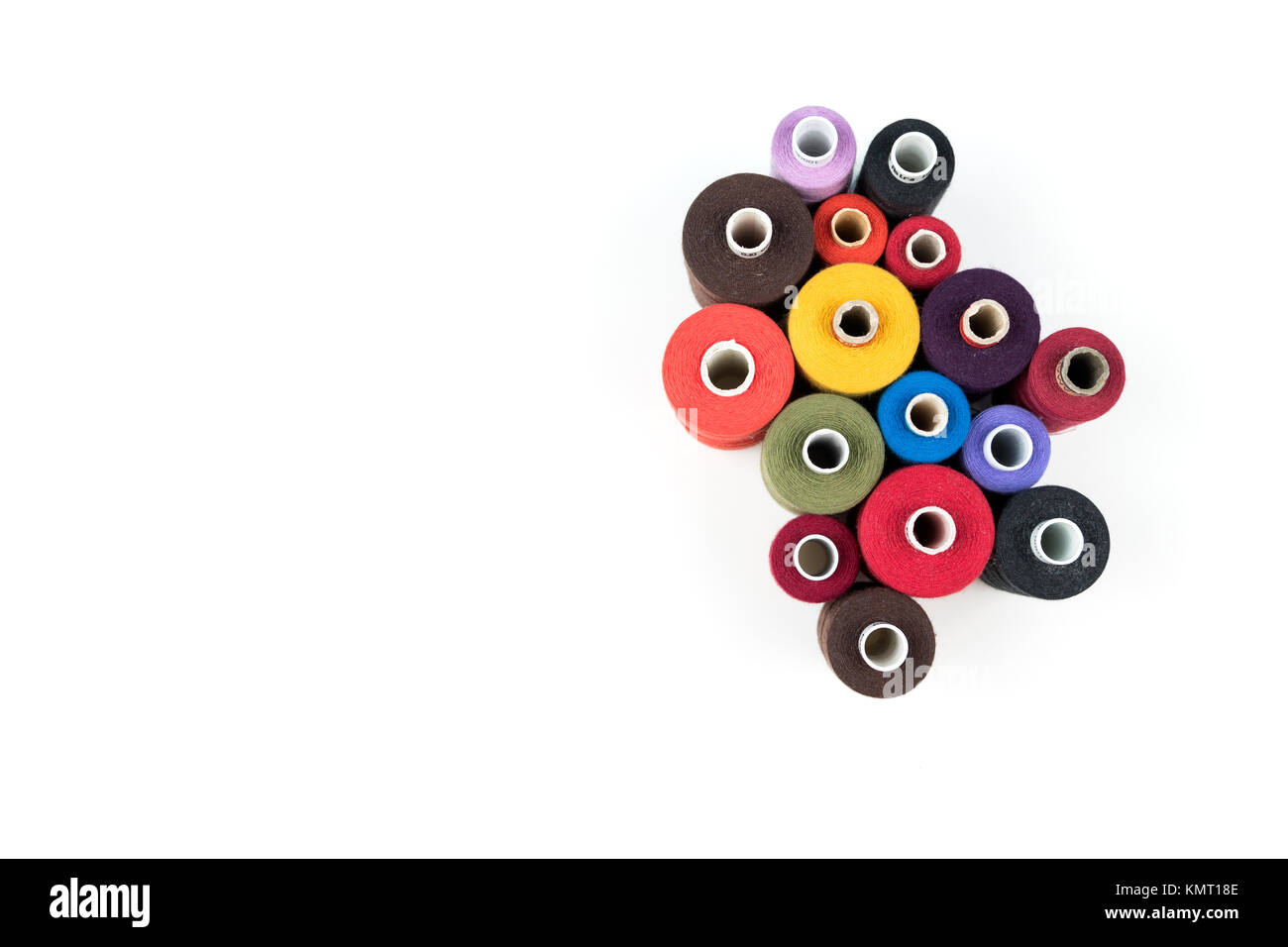 Set of colored thread coils on white background, sewing and tailoring