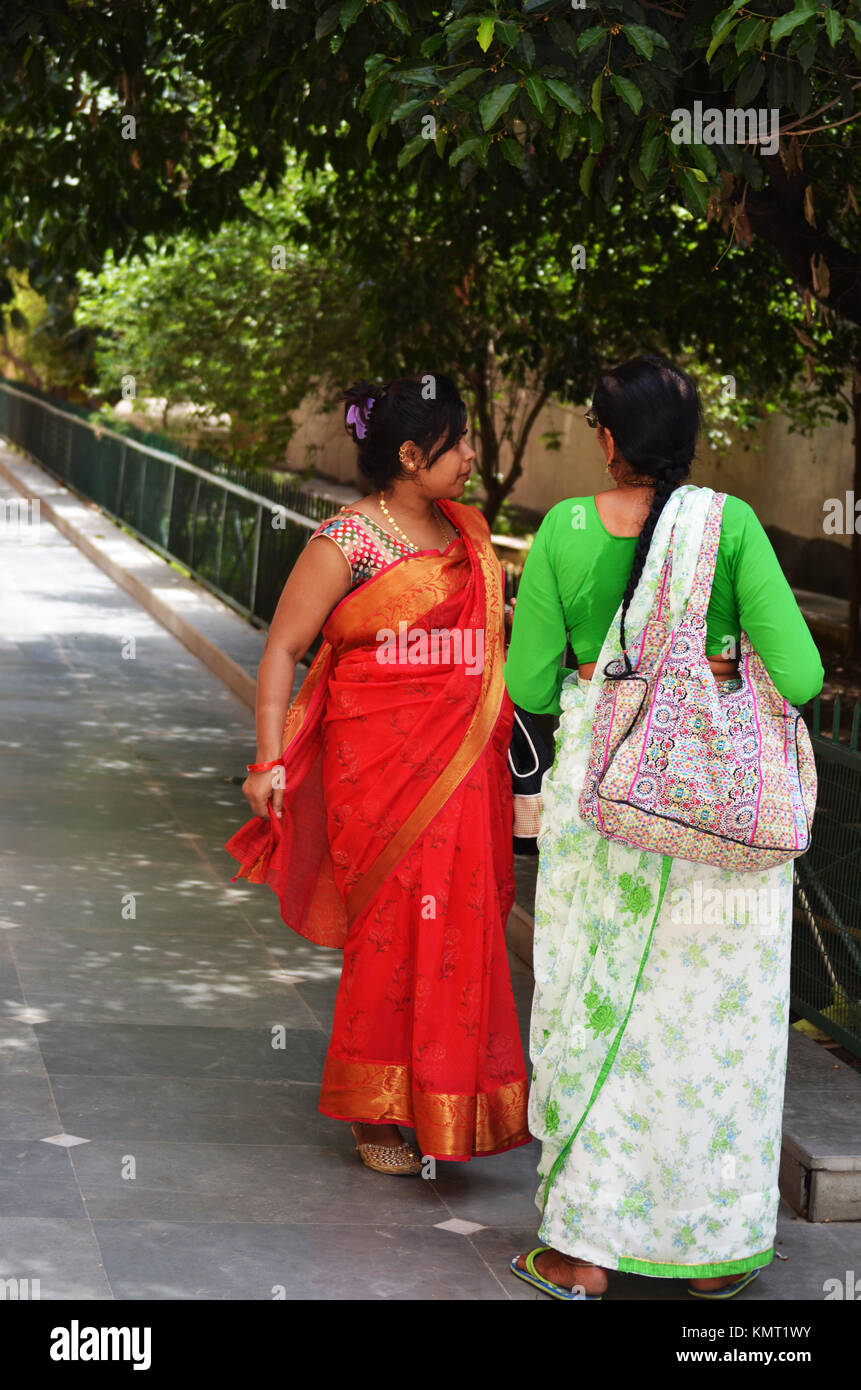 Indian ladies talking in street in New Delhi India Stock Photo