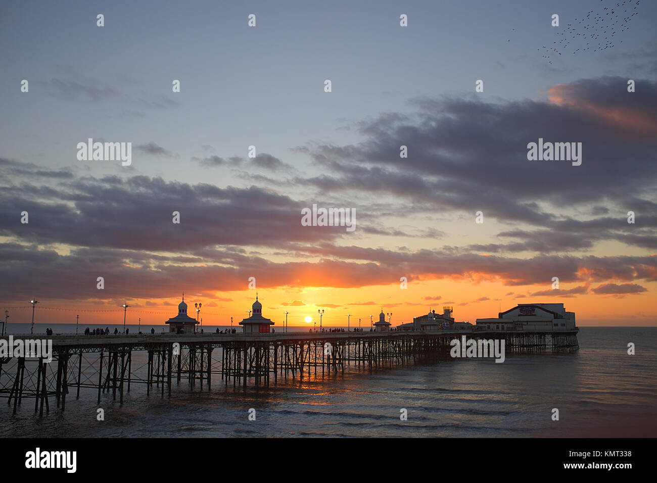 Blackpool North Pier with sun setting over the sea Stock Photo