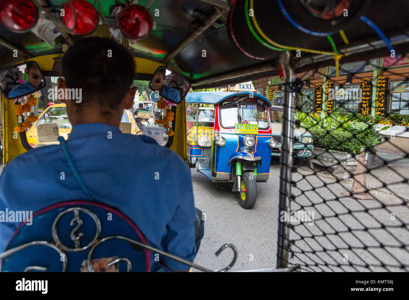 Bangkok, Thailand.  Passenger's Street View from inside a Tuk-Tuk (Three-wheeled motorcycle taxi.) Stock Photo
