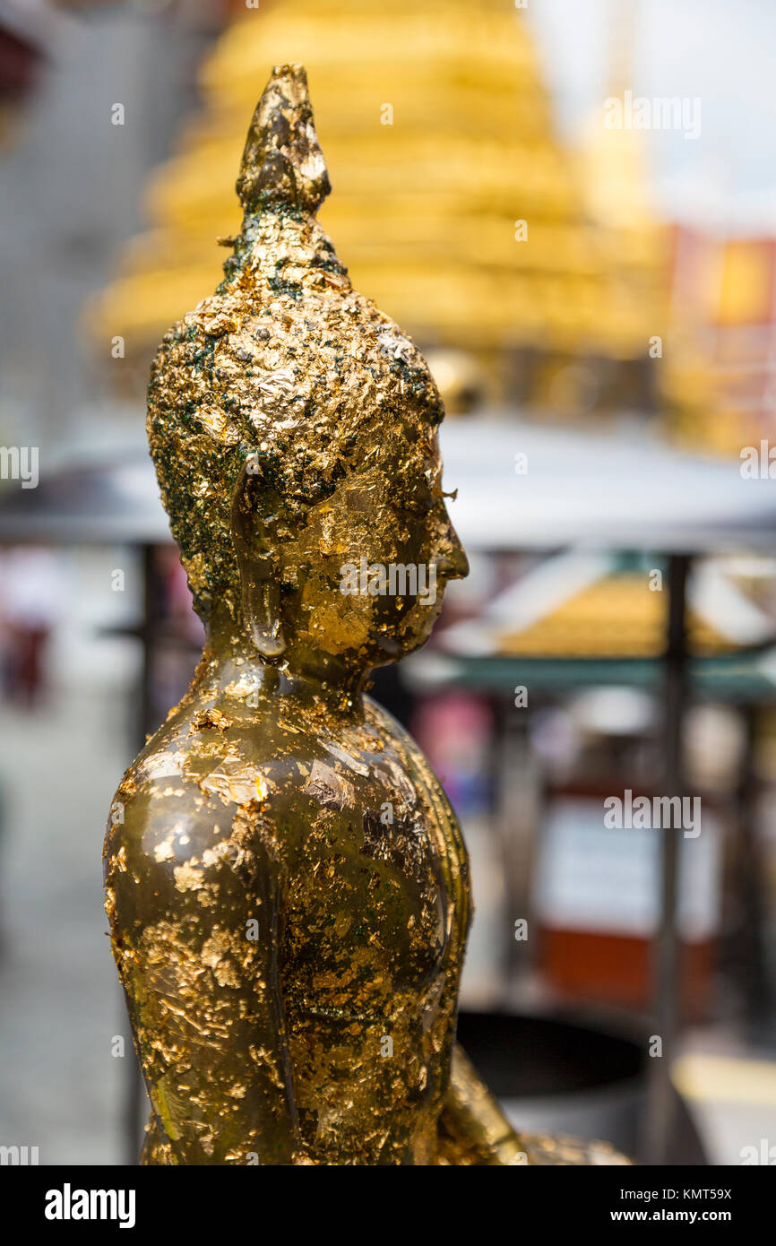 Bangkok, Thailand.  Buddha Statue Covered with Gold Leaf Placed by Worshipers, Royal Grand Palace Compound. Stock Photo