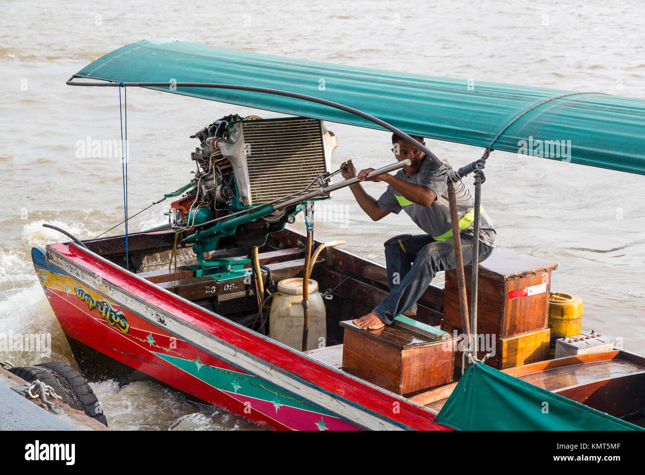 Bangkok, Thailand.  Engine Powering a Water Taxi on the Chao Phraya River. Stock Photo