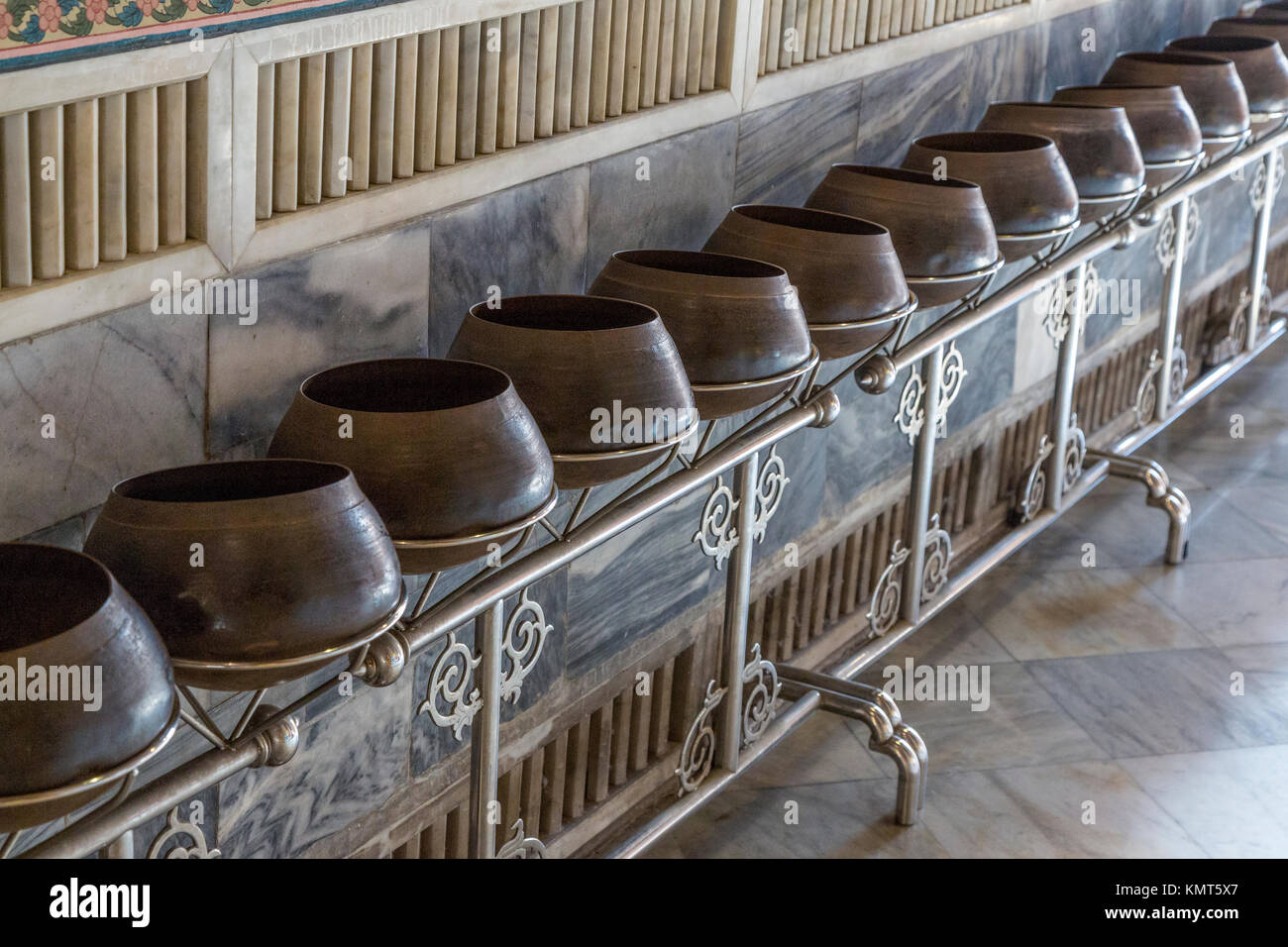 Bangkok, Thailand.  Wat Pho Temple.   Pots for Receiving Coins from Worshipers Seeking Blessings or Good Fortune. Stock Photo