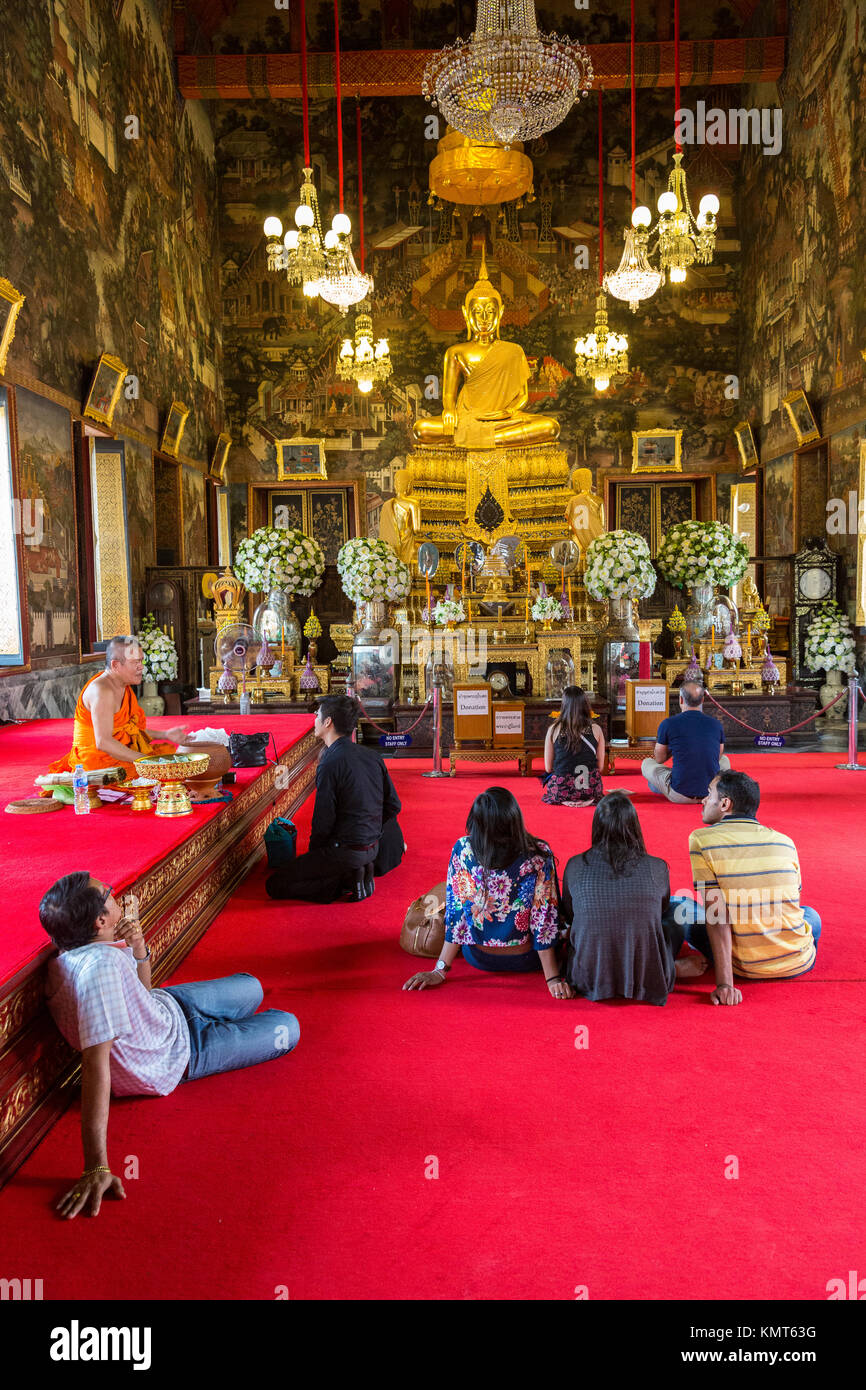 Bangkok, Thailand.  Tourists and Worshipers Intermingle at the Ubosot of the Wat Arun Temple. Stock Photo
