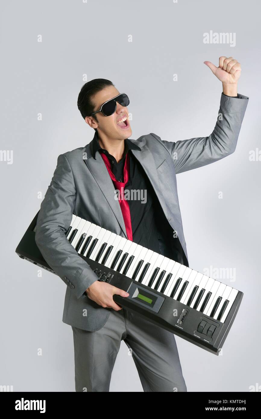 Playing piano suit hi-res stock photography and images - Alamy