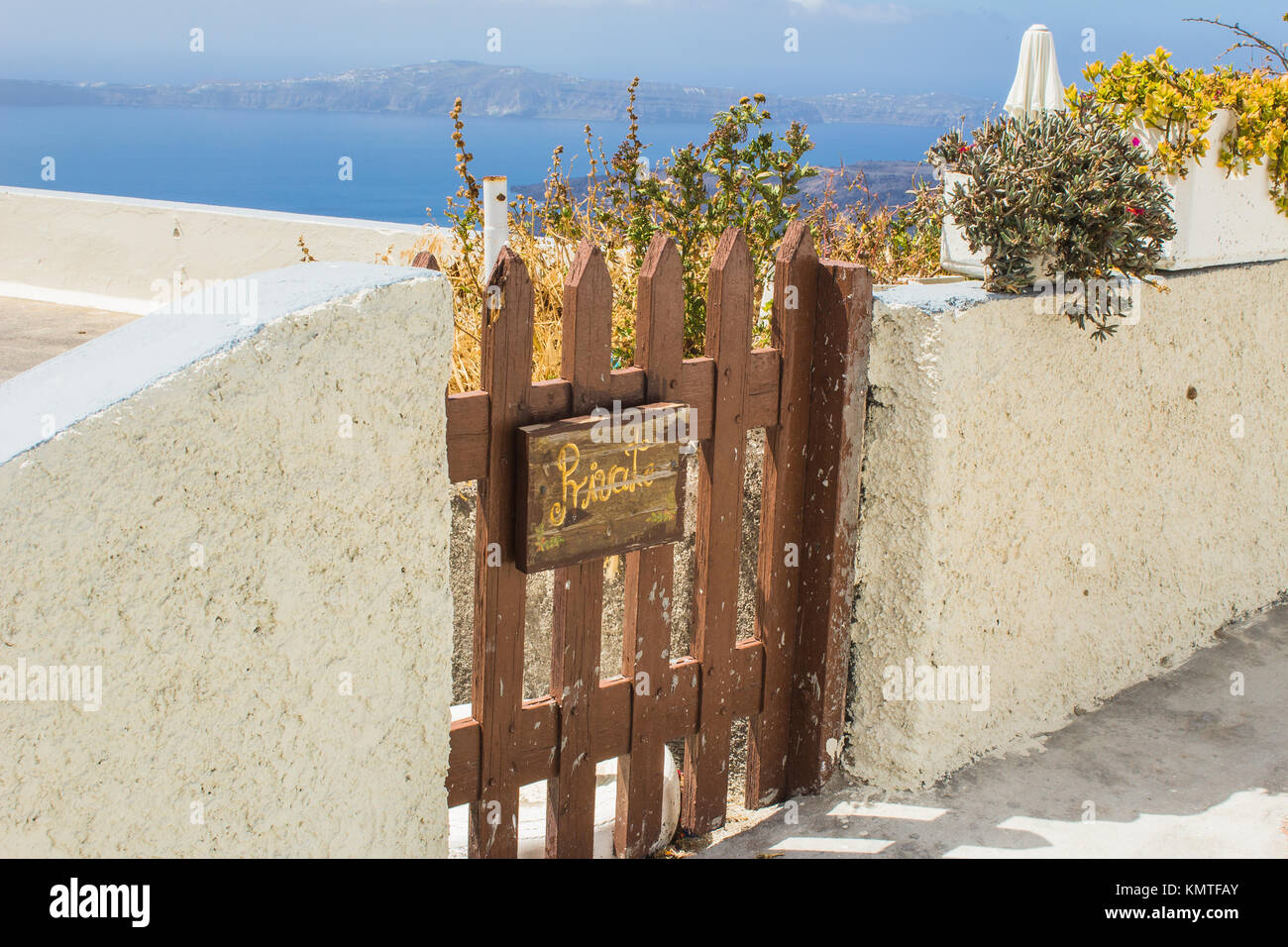 Rustic Wooden Gate outside a Greek home in a village on the island of Santorini, Greece Stock Photo