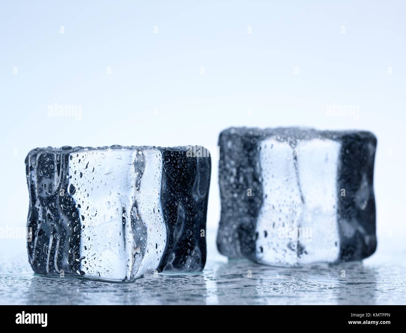 Frozen ice cubes isolated on a kitchen bench Stock Photo - Alamy