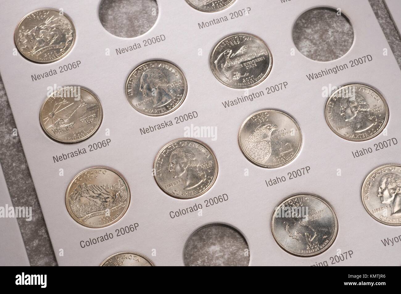 U S state quarters coin collection in book Stock Photo - Alamy