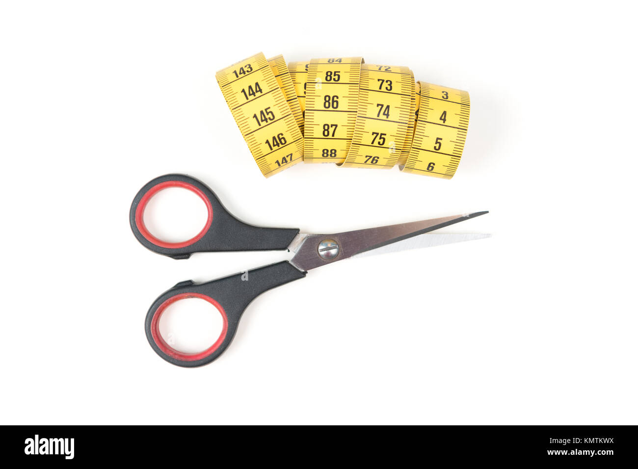Sewing small scissors with yellow measuring tape on a white background