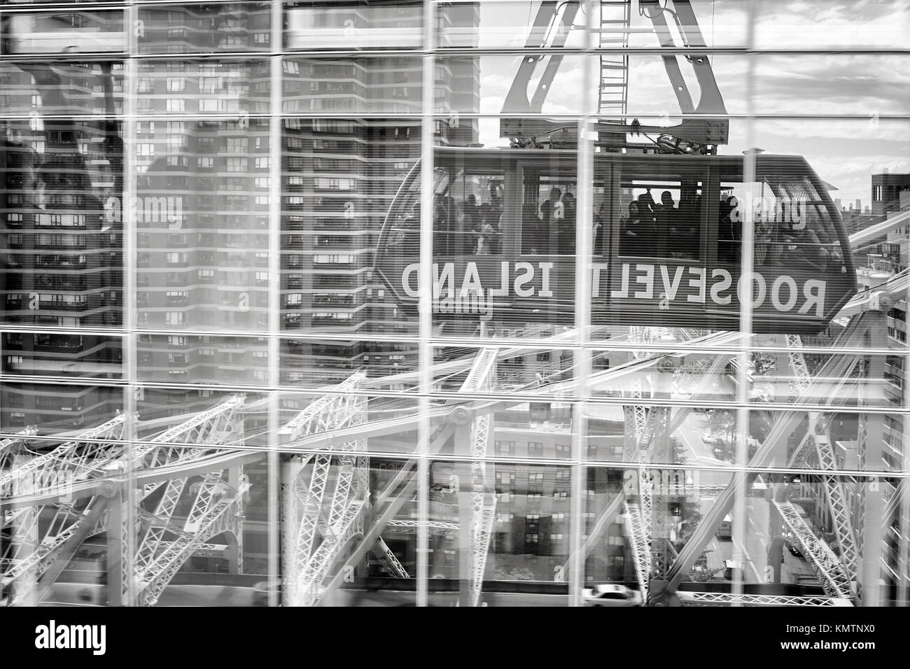 New York, USA - May 26, 2017: Roosevelt Island cable tramway car reflected in buildings windows. Stock Photo