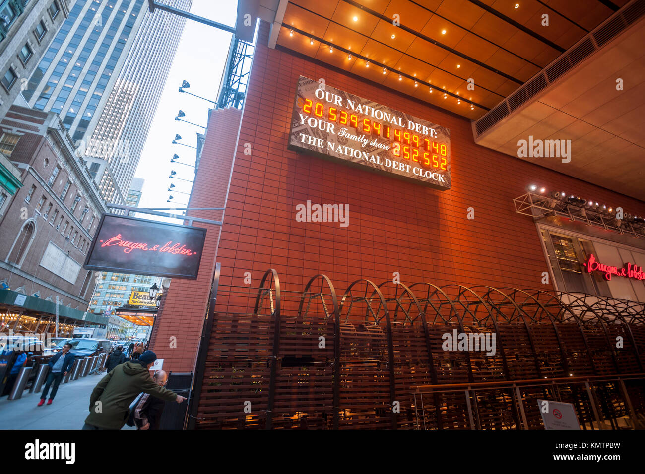 The National Debt Clock is seen at its new location in Anita's Way, a Privately Owned Public Space (POPS), off of Times Square in Midtown in New York on Friday, December 1, 2017. Real-estate mogul, the late Seymour Durst, created the clock on Feb. 20, 1989 to call attention to Reaganomics. The 'innards' of the clock were updated but the exterior was not redesigned. (© Richard B. Levine) Stock Photo