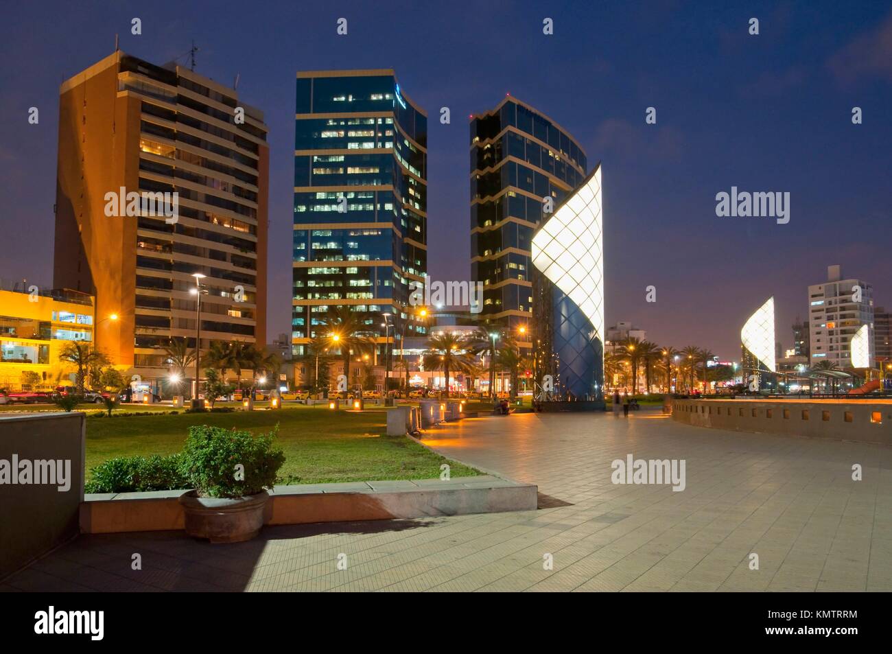 The seaside Shopping Center and apartments illuminated at