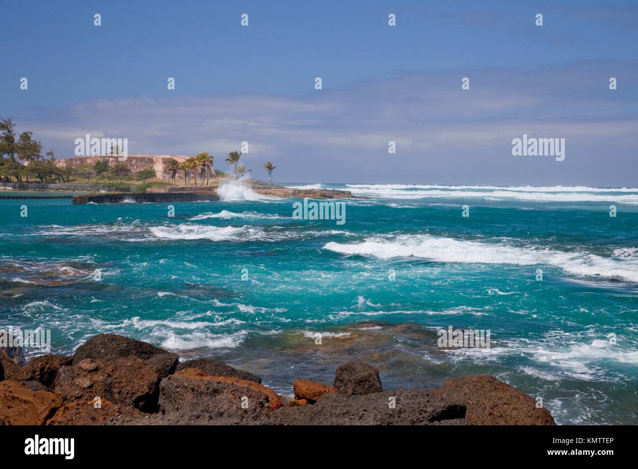 Waves and surf at the Caribbean Sea beach at the Caribe Hilton Stock Photo  - Alamy