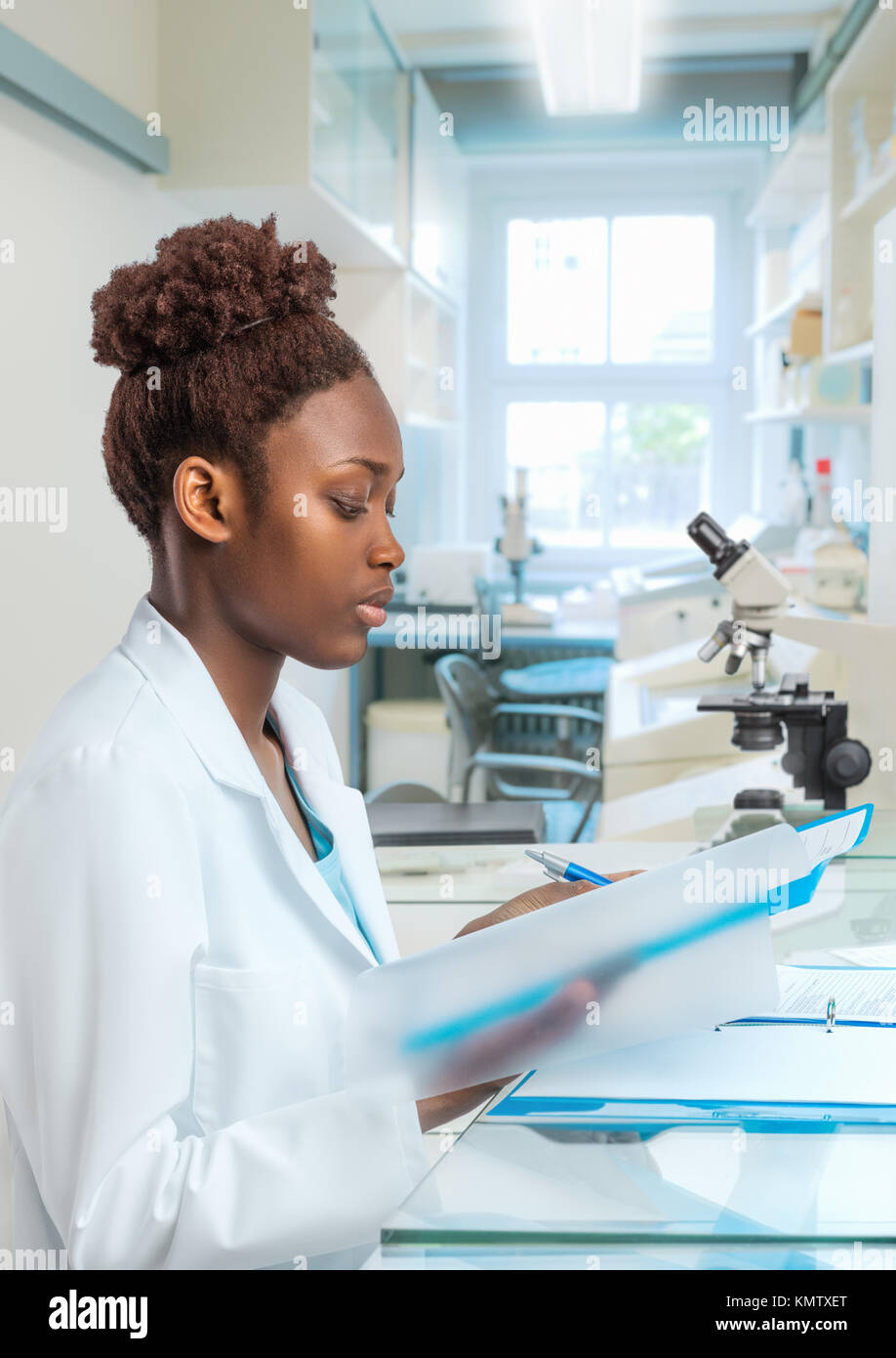 African scientist, medical worker, tech or graduate student works in modern biological laboratory Stock Photo